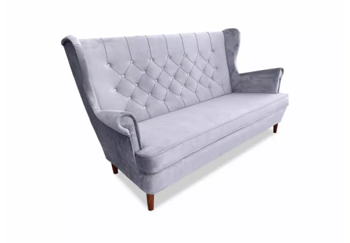 sofa Kevin I z eleganckimi przeszyciami w nowoczesnym wnętrzu