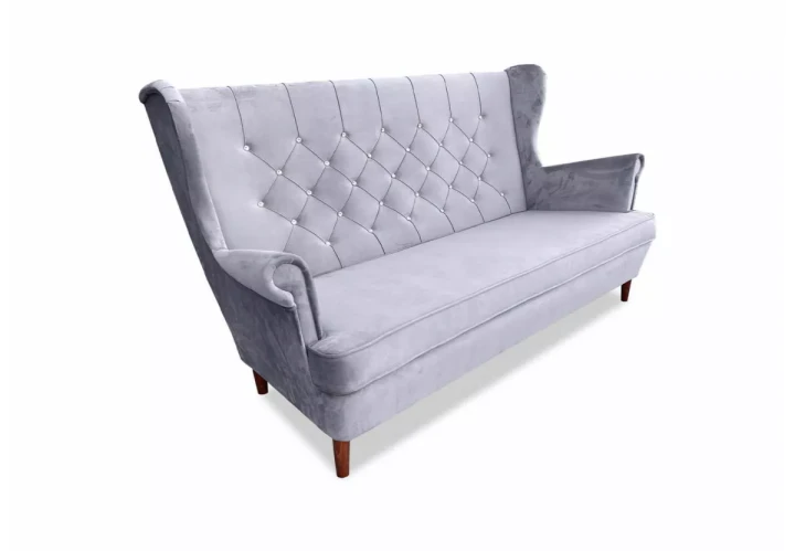 sofa Kevin I z eleganckimi przeszyciami w nowoczesnym wnętrzu